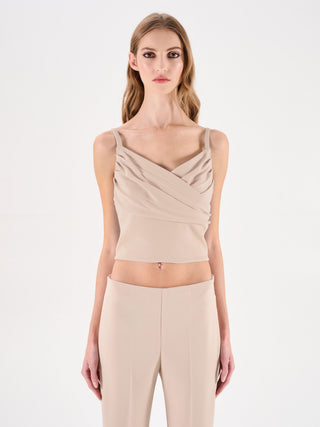 Top beige chiaro con incrocio drappeggiato