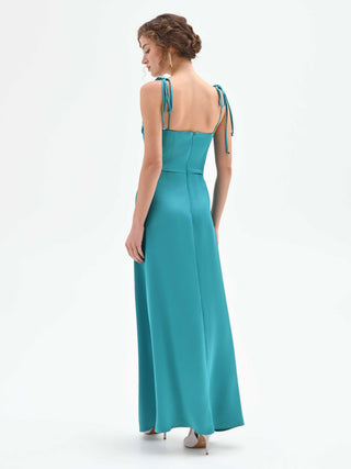 Emerald green atelier gown with a draped neckline