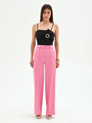 Pink palazzo trousers with a jeweled belt