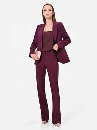 Pantalone svasato bordeaux in tessuto tecnico con fascione in vita