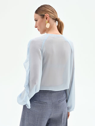 Blusa azzurro cielo con rouches