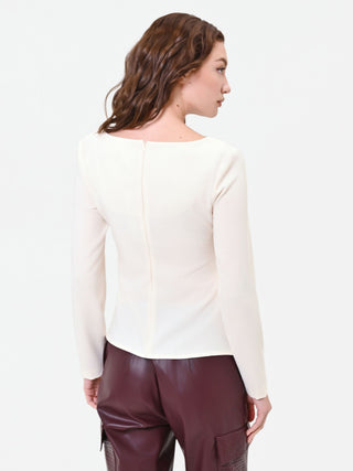 Blouse blanche à drapé asymétrique