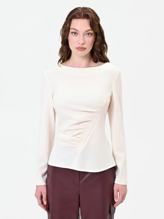 Blouse blanche à drapé asymétrique
