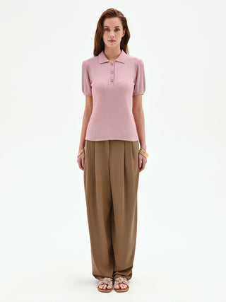 Polo in maglia rosa con lavorazione a costine