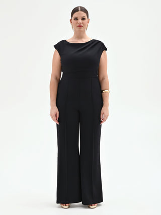 Tuta nera curvy con scollo asimmetrico