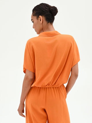 Camicia arancione in lino con nodo